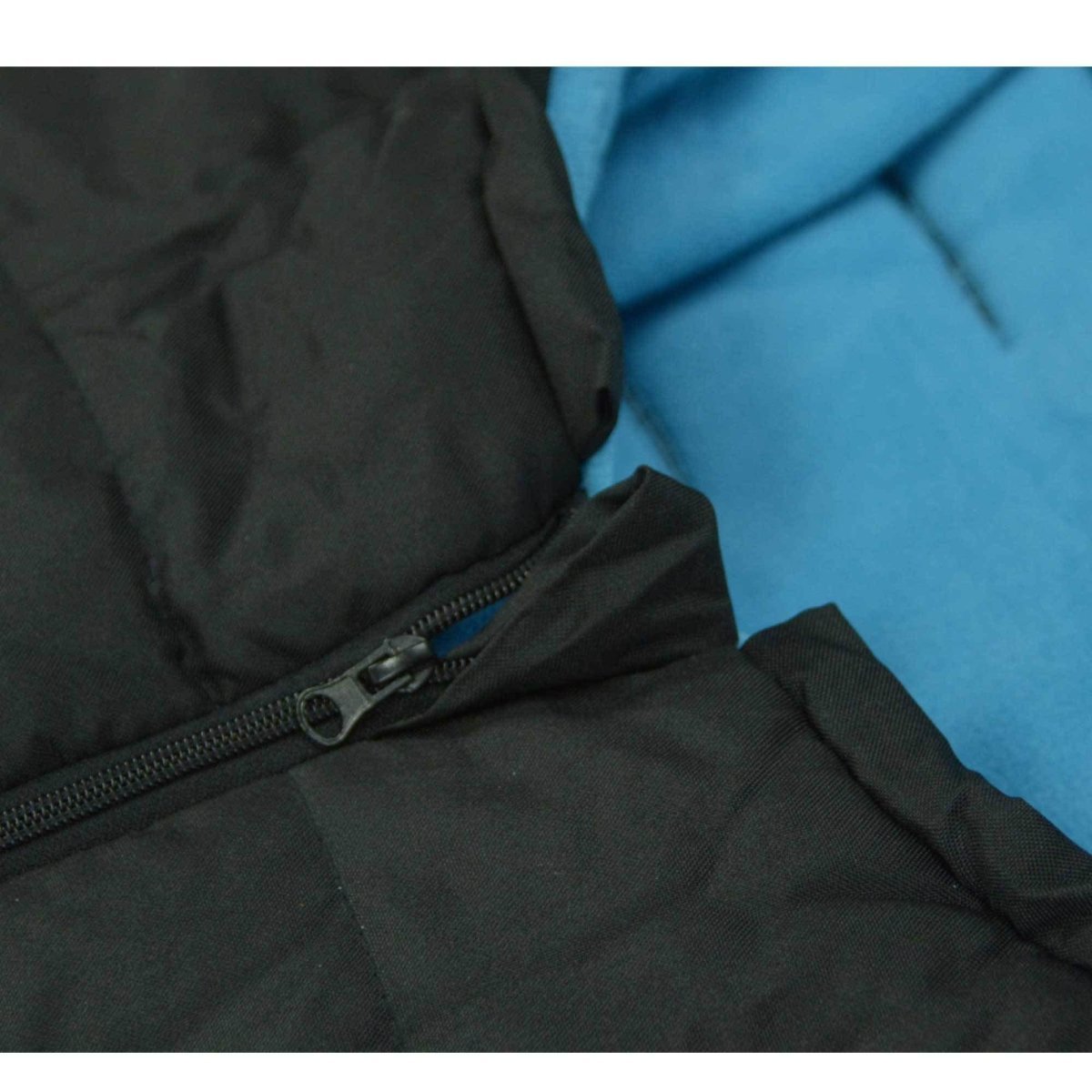 Close-up of a black footmuff with a zipper with a blue inner