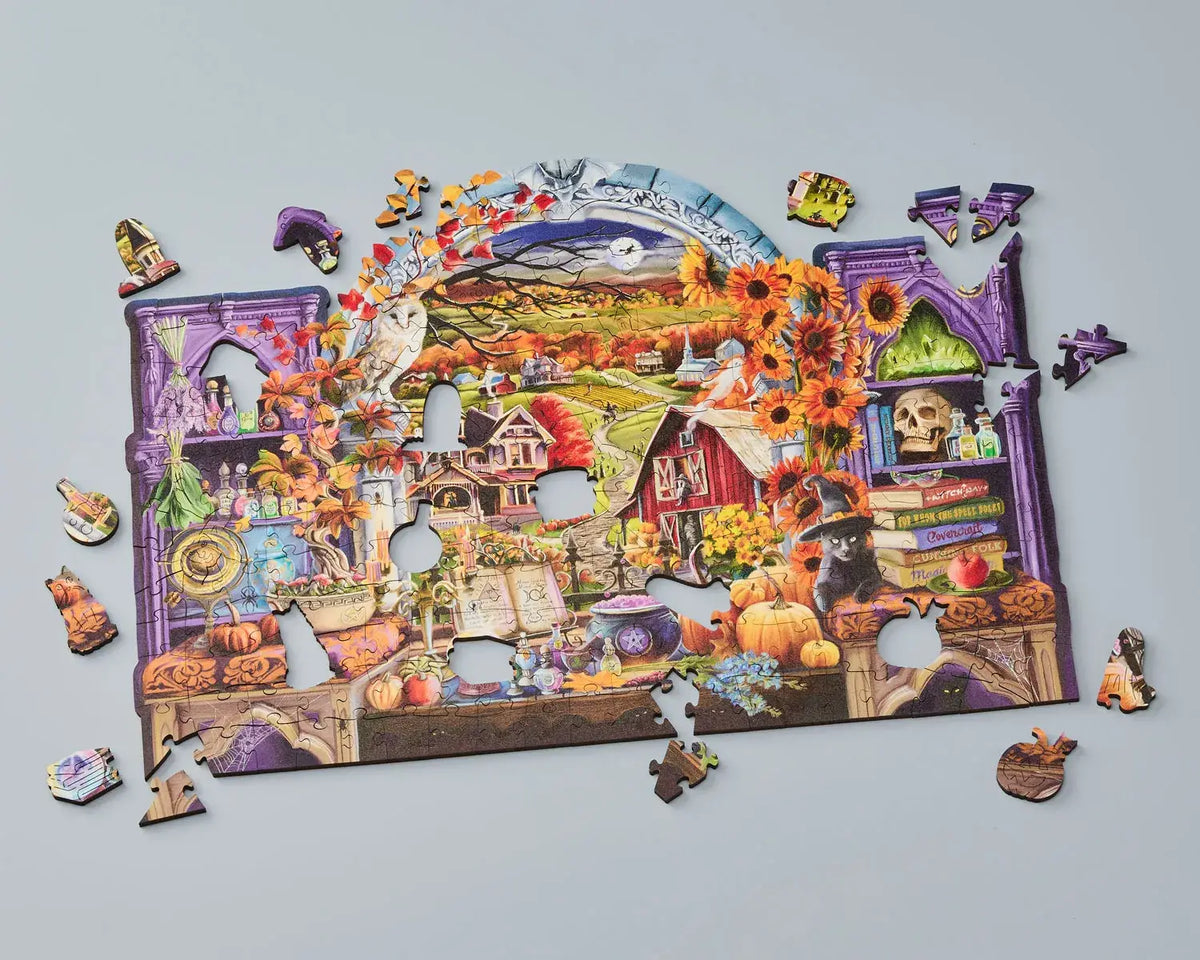 Wentworth Through the Window Halloween wooden puzzle partly completed with irregular pieces and themed whimsies