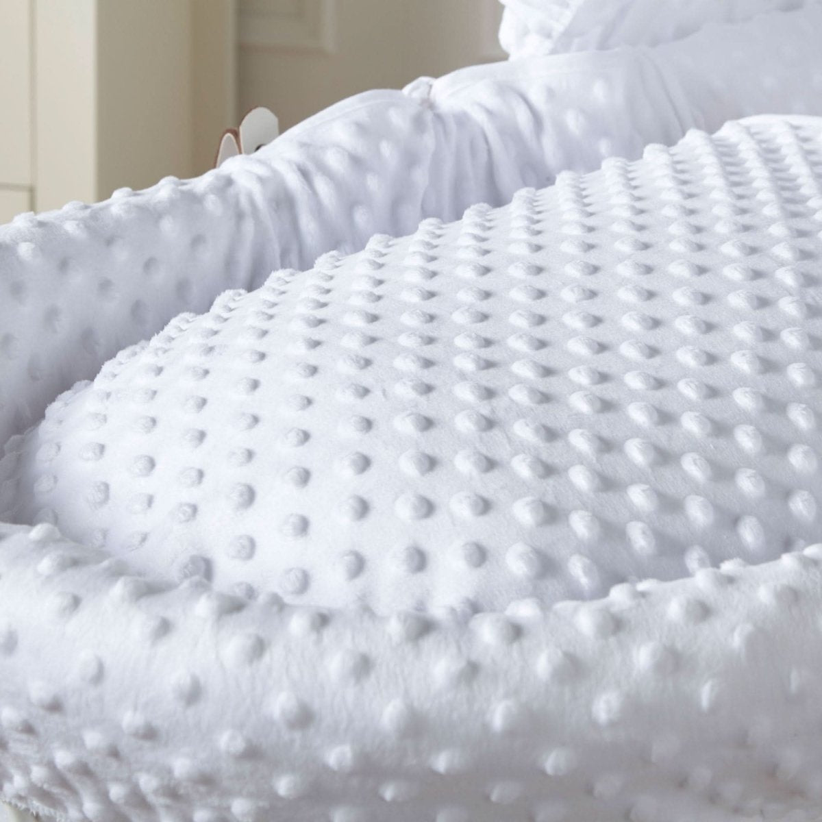 White Dimple Wicker Baby Moses Basket With Stand soft dimple bedding close-up