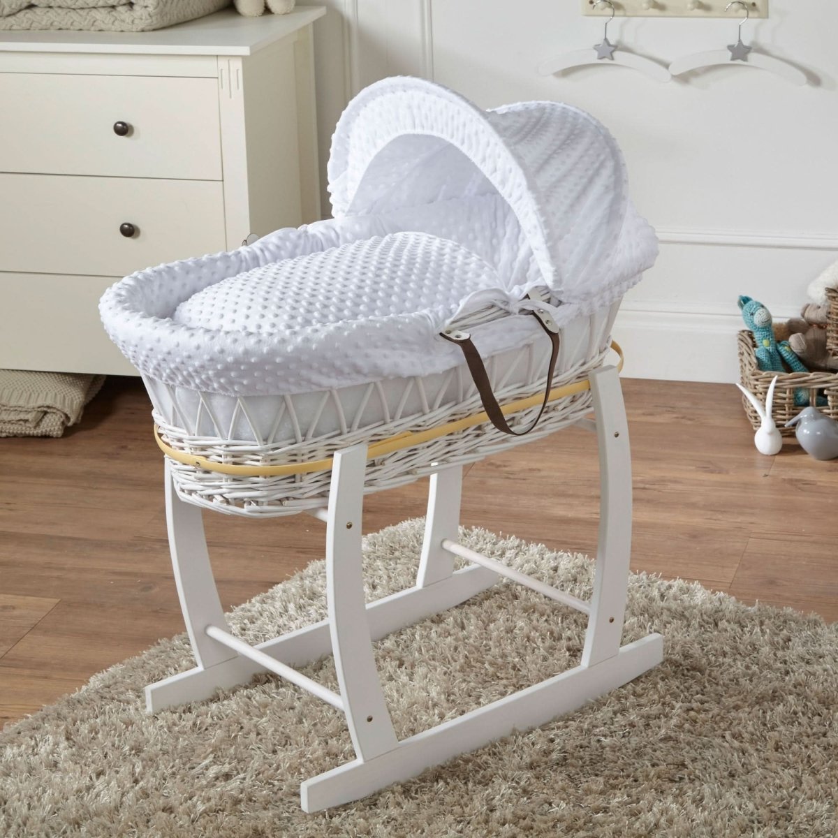 White Dimple Wicker Baby Moses Basket With Stand in a neutral nursery