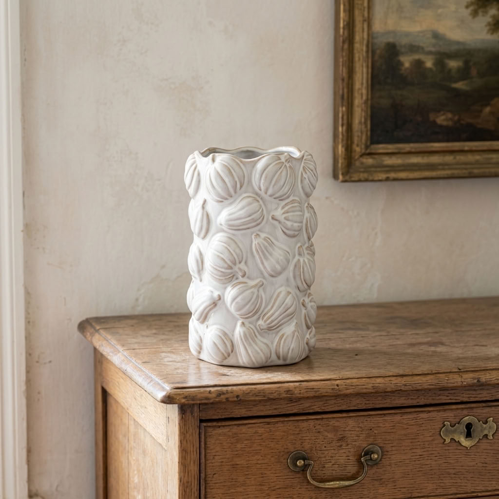 White Pumpkin Ceramic Vase displayed empty on an antique wooden chest in a traditional English country home