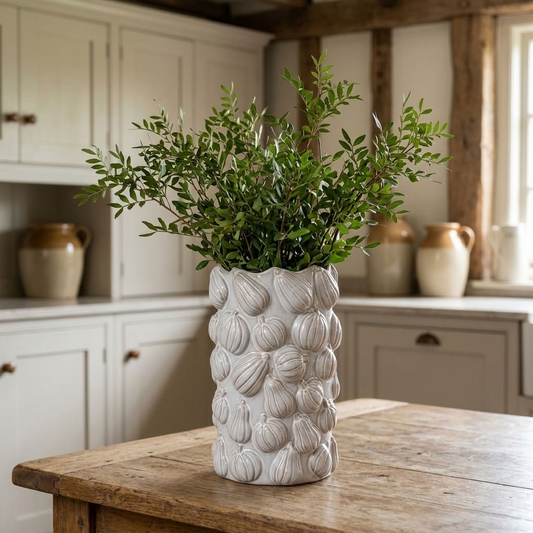 White Pumpkin Ceramic Vase with leafy green branches styled on an oak table in an English country kitchen