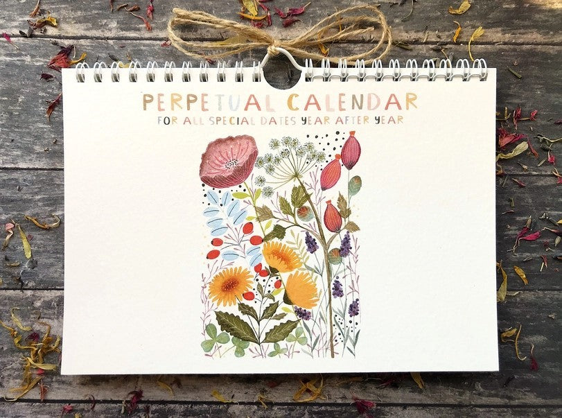 Wildflower Perpetual Calendar front cover with colourful botanical illustrations, wire binding and rustic twine hanging loop