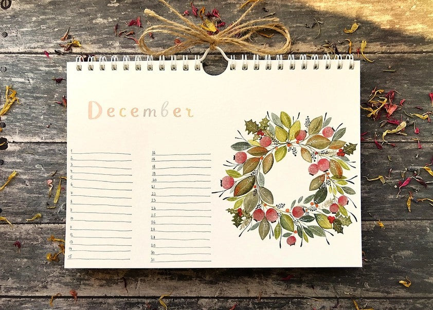 Wildflower Perpetual Calendar December page with an illustrated wreath of seasonal foliage and berries