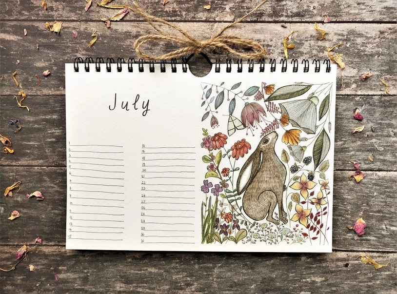 Wildlife & Botanical Perpetual Calendar July page featuring a brown hare amongst colourful flowers and botanical foliage
