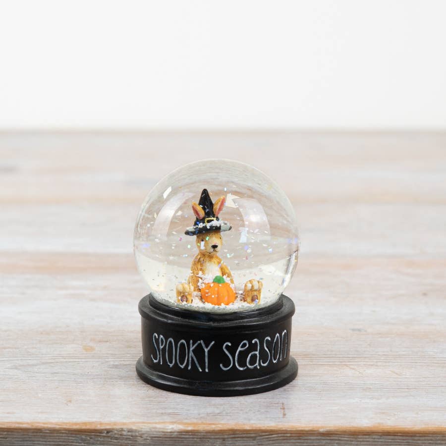 Witch Rabbit Snow Globe 9cm with orange pumpkin, shimmering flakes and black Spooky Season base