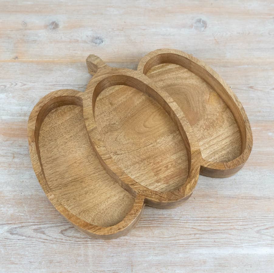 Pumpkin-shaped wooden serving tray showing natural wood grain and sculpted design