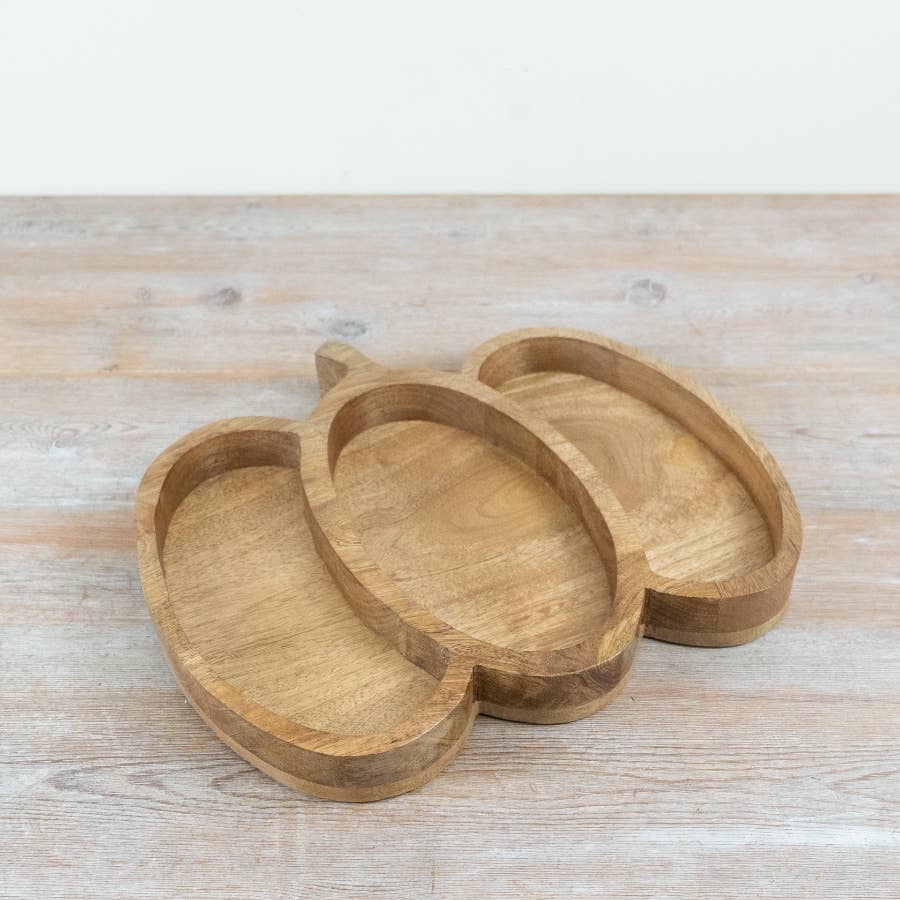 Natural wooden pumpkin-shaped serving tray for autumn entertaining