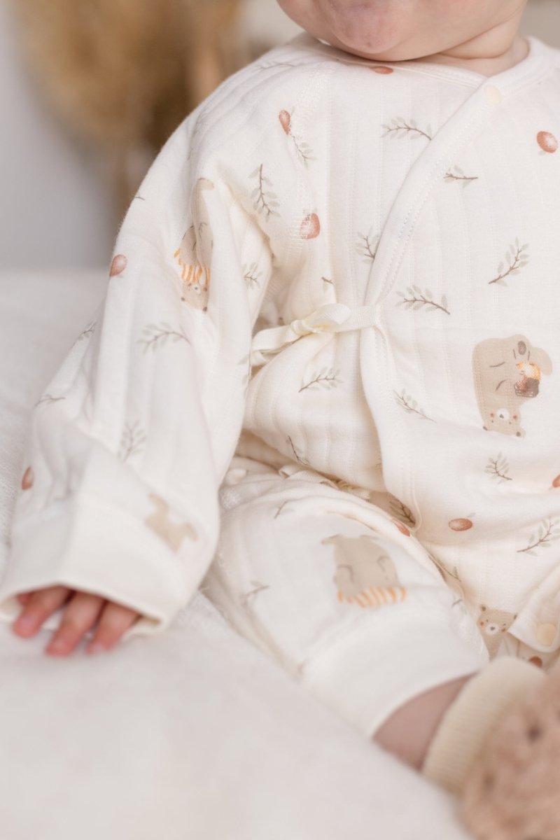 Close-up of the Woodland Bear Baby Grow Romper showing the forest-inspired print