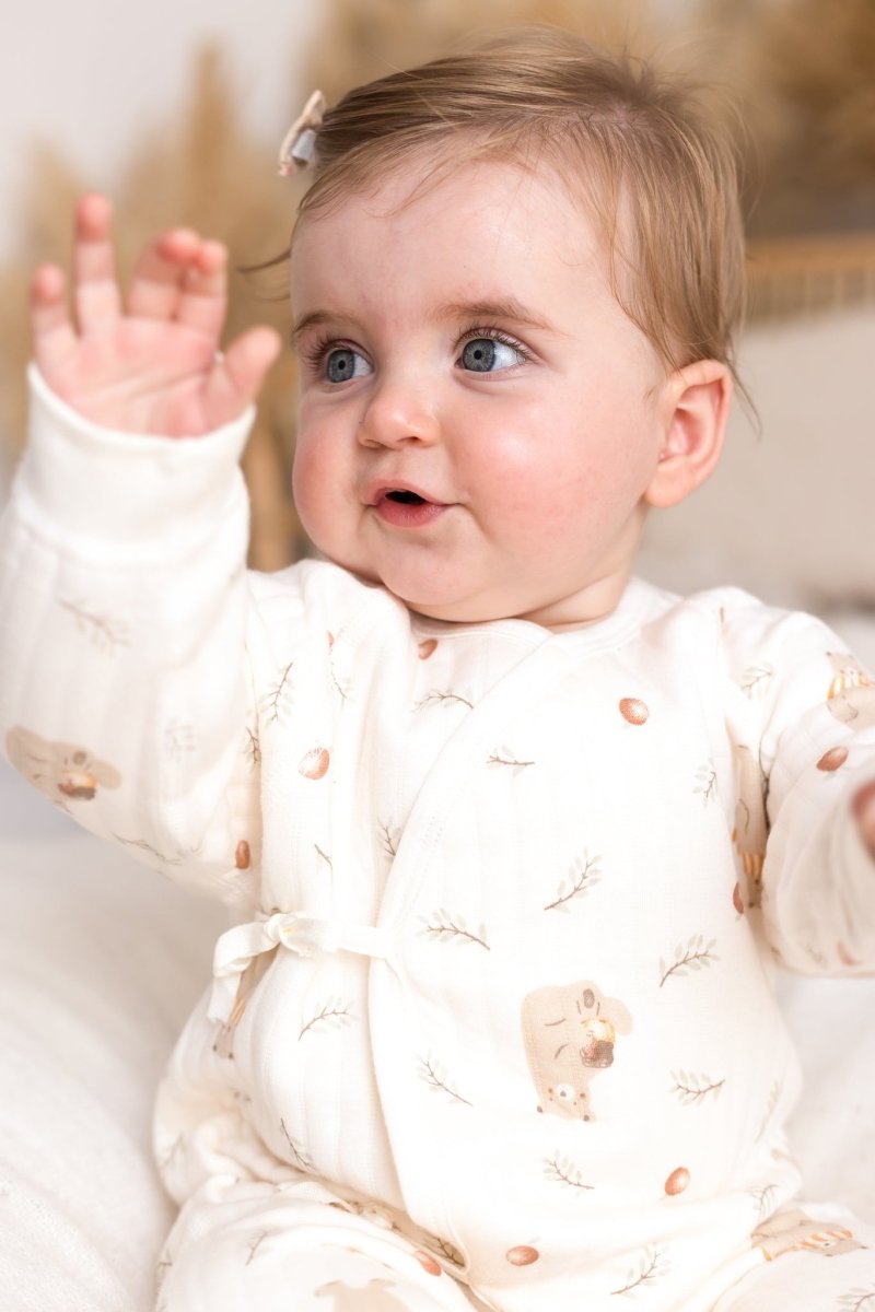 Baby wearing The Woodland Bear Bouclé Wrap Baby Grow Romper