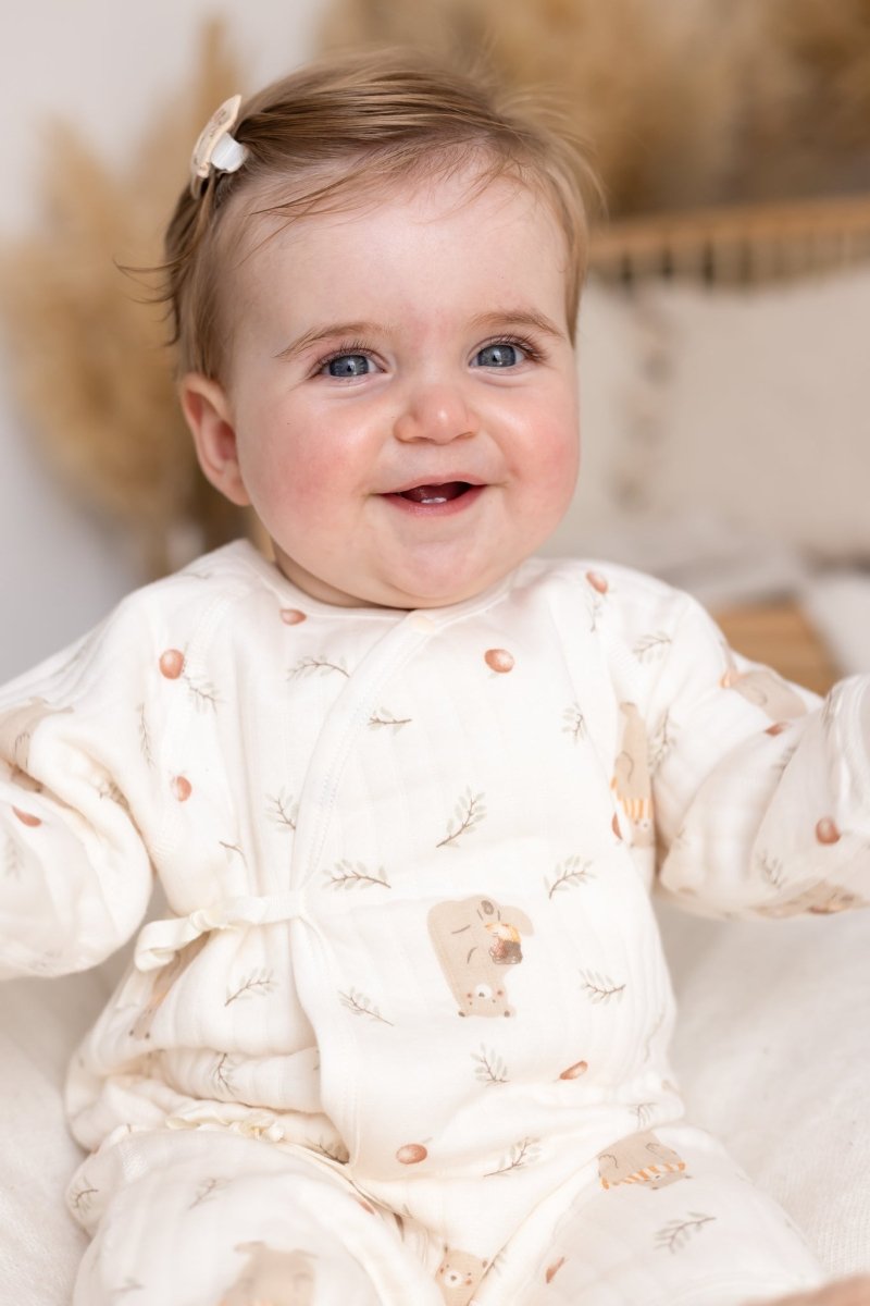 Front view of baby wearing the Woodland Bear Wrap Baby Grow Romper